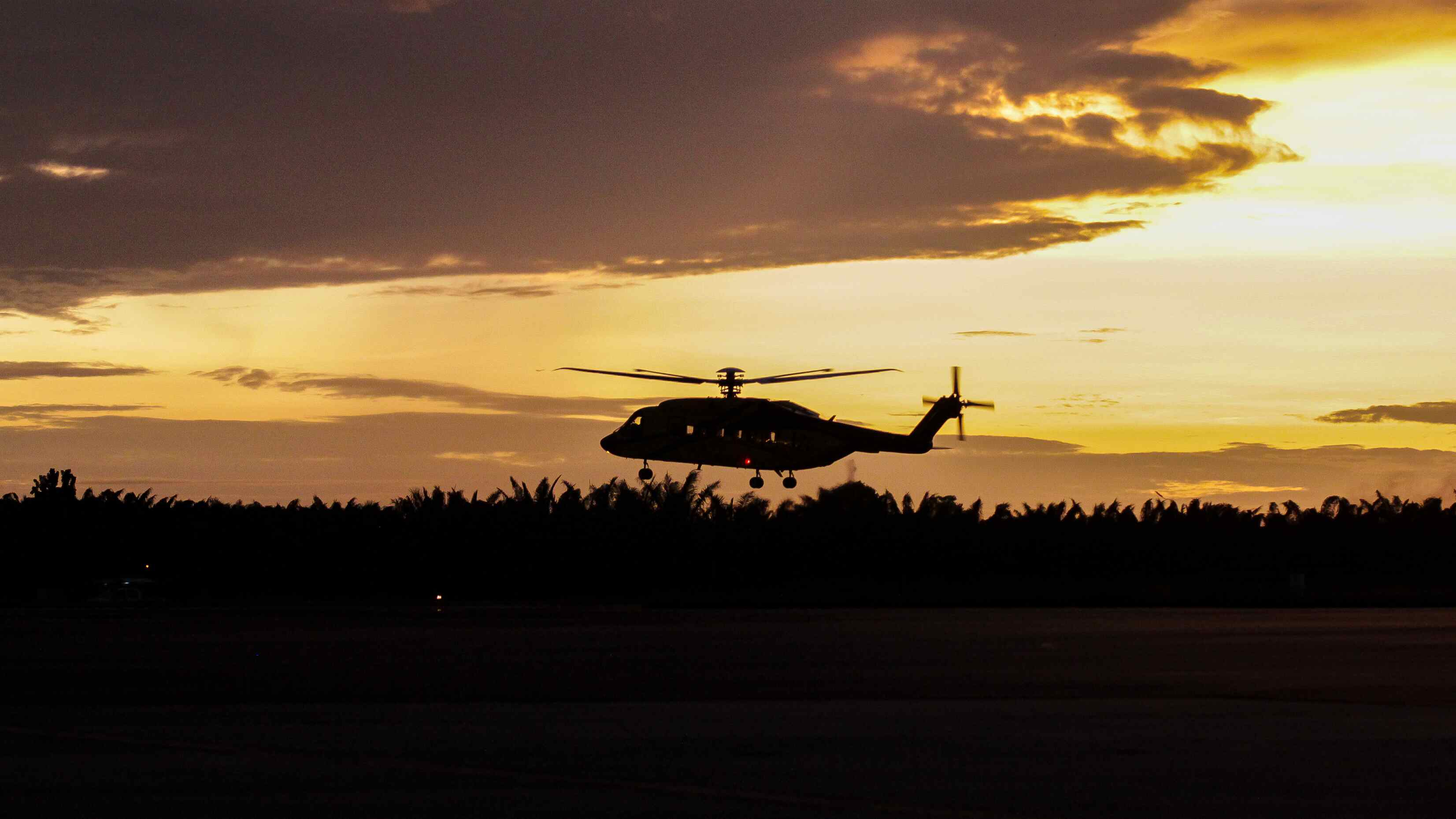 PHI Century S-92A taking-off at sunset